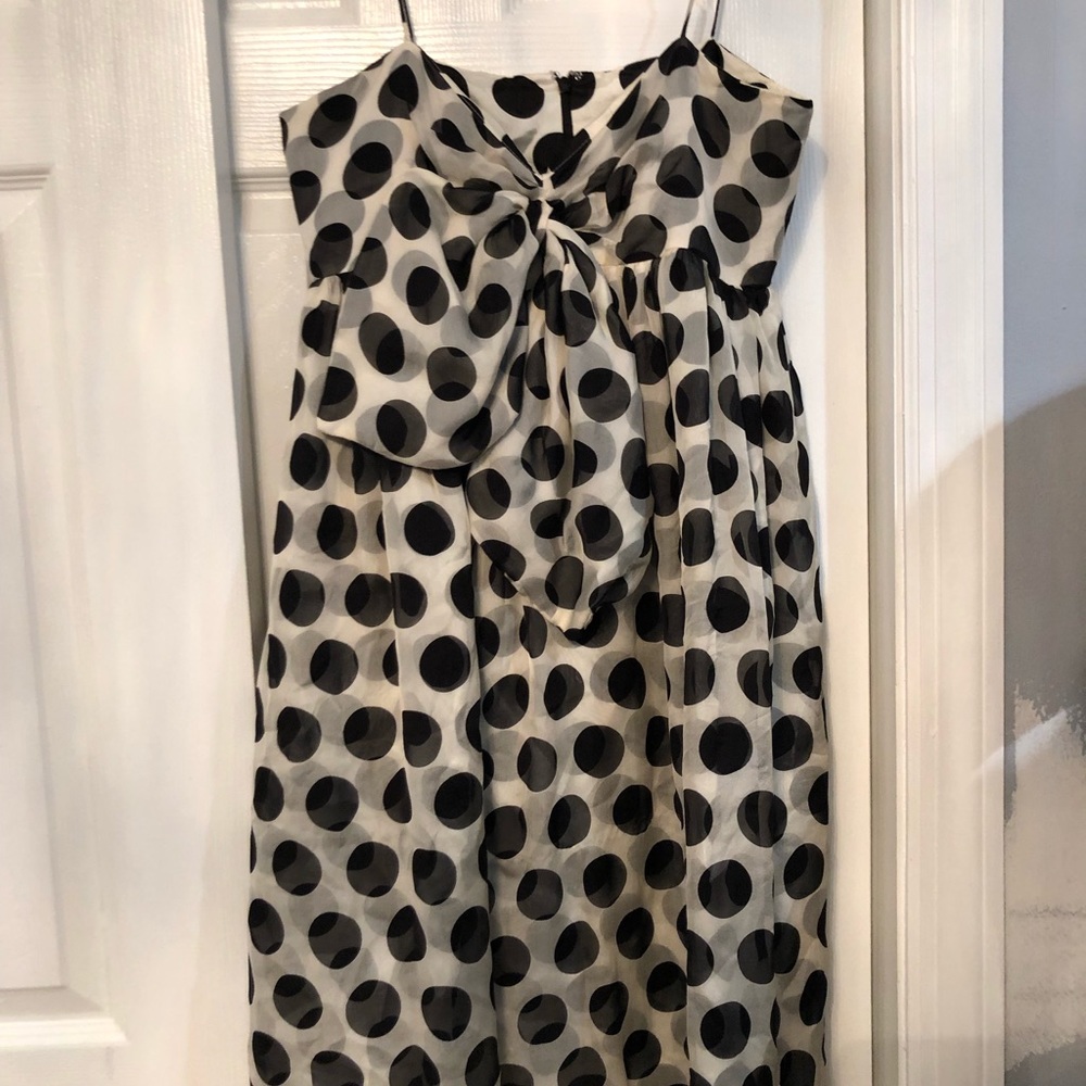 A mini dress with black dots